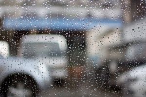 Rain on windshield by garage